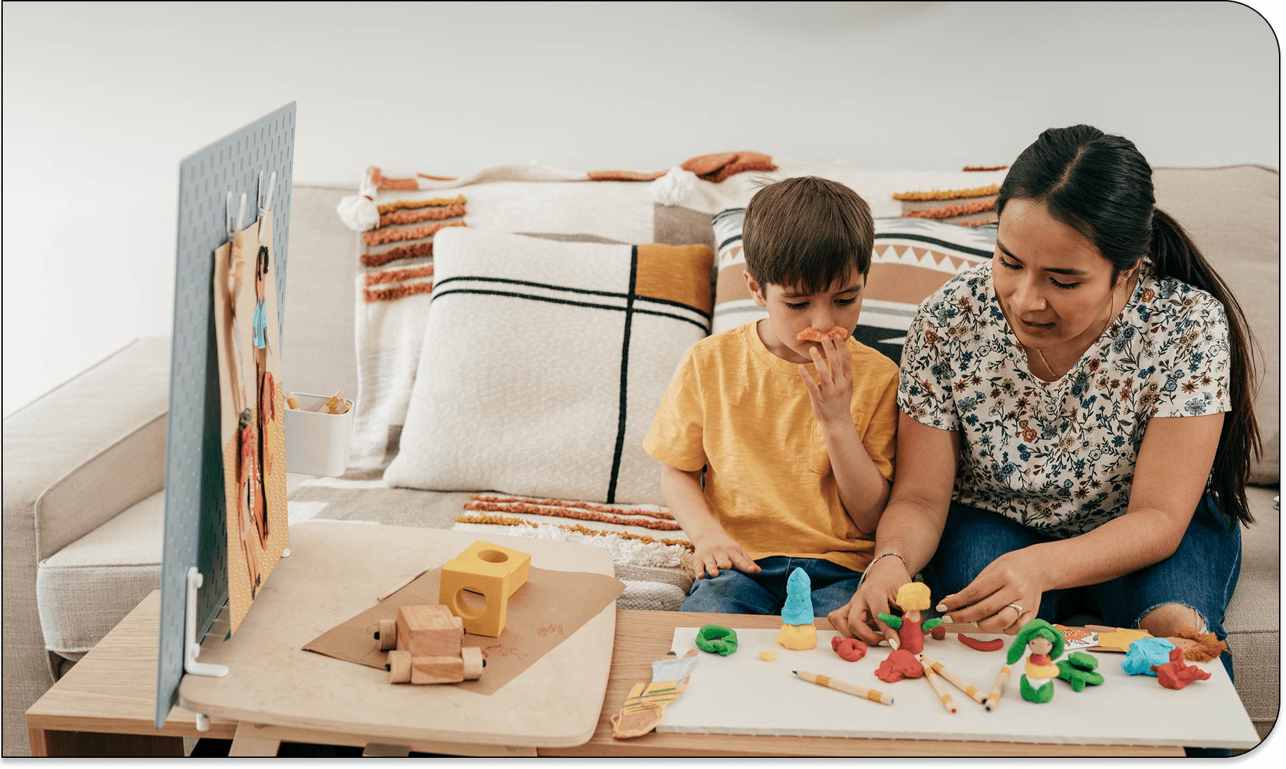 Parent guiding child in creative activity
