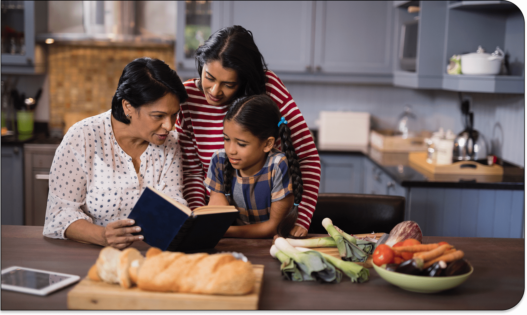 Mother and daughters preparing meal