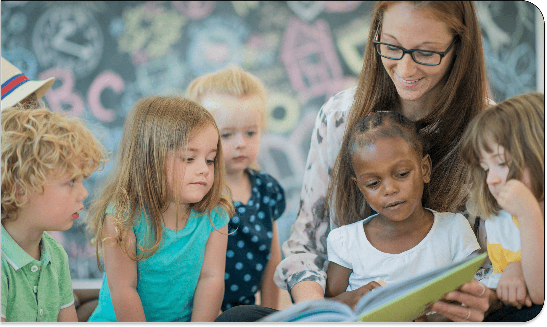 Teacher reading to children in classroom
